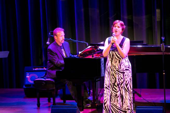 Joan Sobel, accompanied by Philip Fortenberry on the piano, sings a piece during The Composers Showcase at the Cabaret Jazz at The Smith Center, Wednesday Aug. 8, 2012.